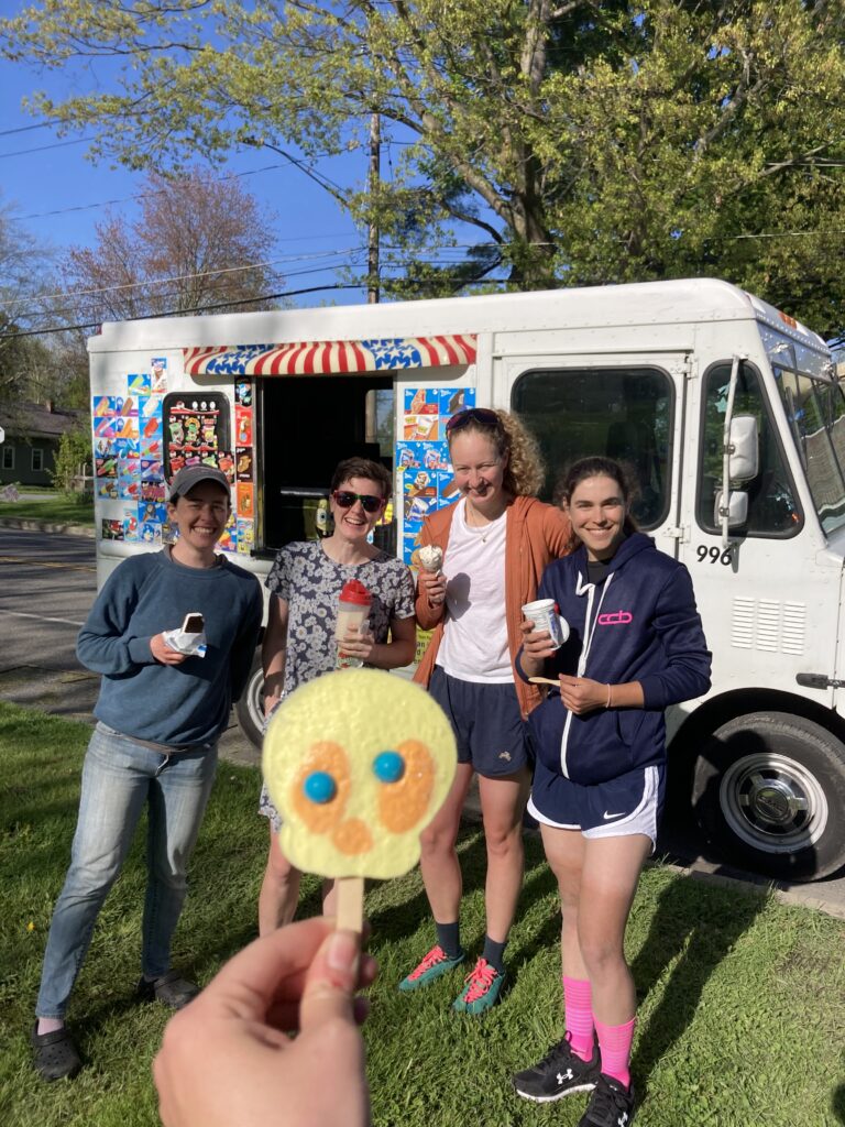 Hannah Varner and BikeReg | Share Coffee teammates celebrating with ice cream after the Battenkill Road Race, highlighting friendship and post-race joy.