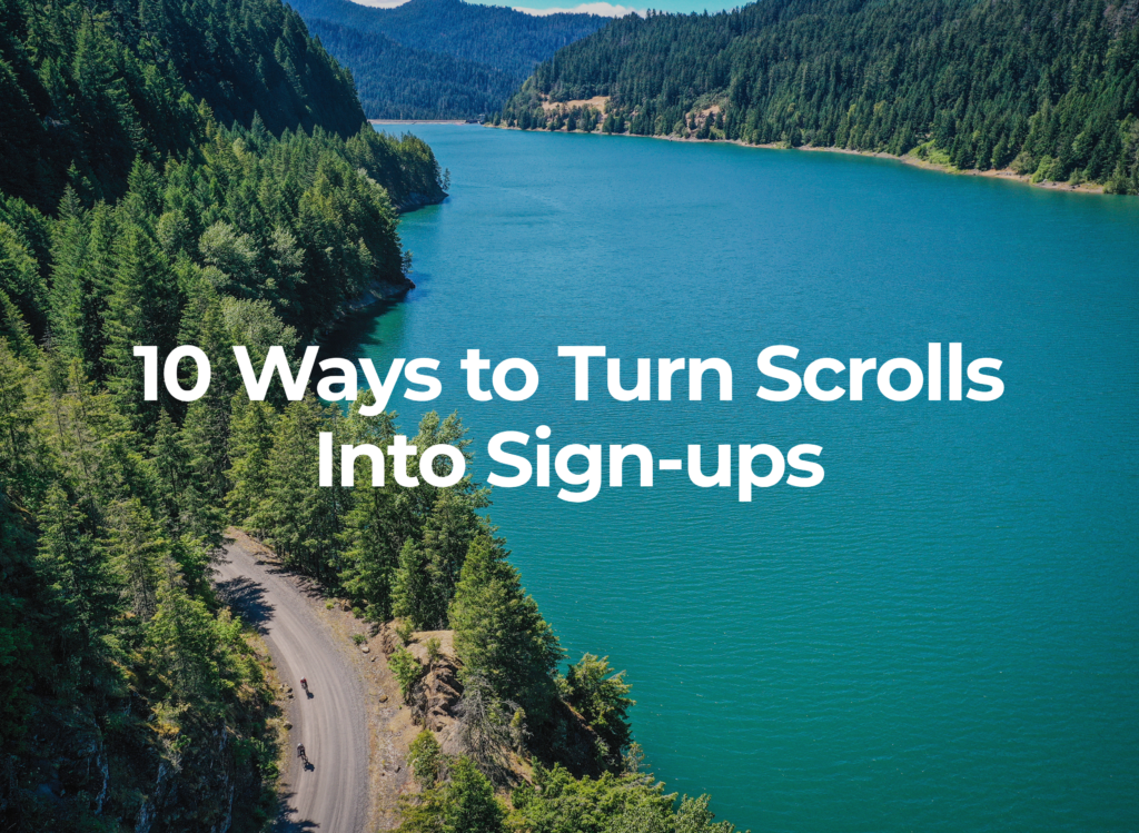 Aerial view of cyclists riding along a gravel road beside a blue lake surrounded by forest in Bend, Oregon during Oregon Trail Gravel.